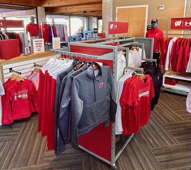 Racks of branded women's shirts and sweaters